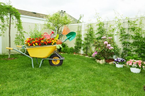 Crew setting up eco-friendly waste disposal area in a Sydenham garden